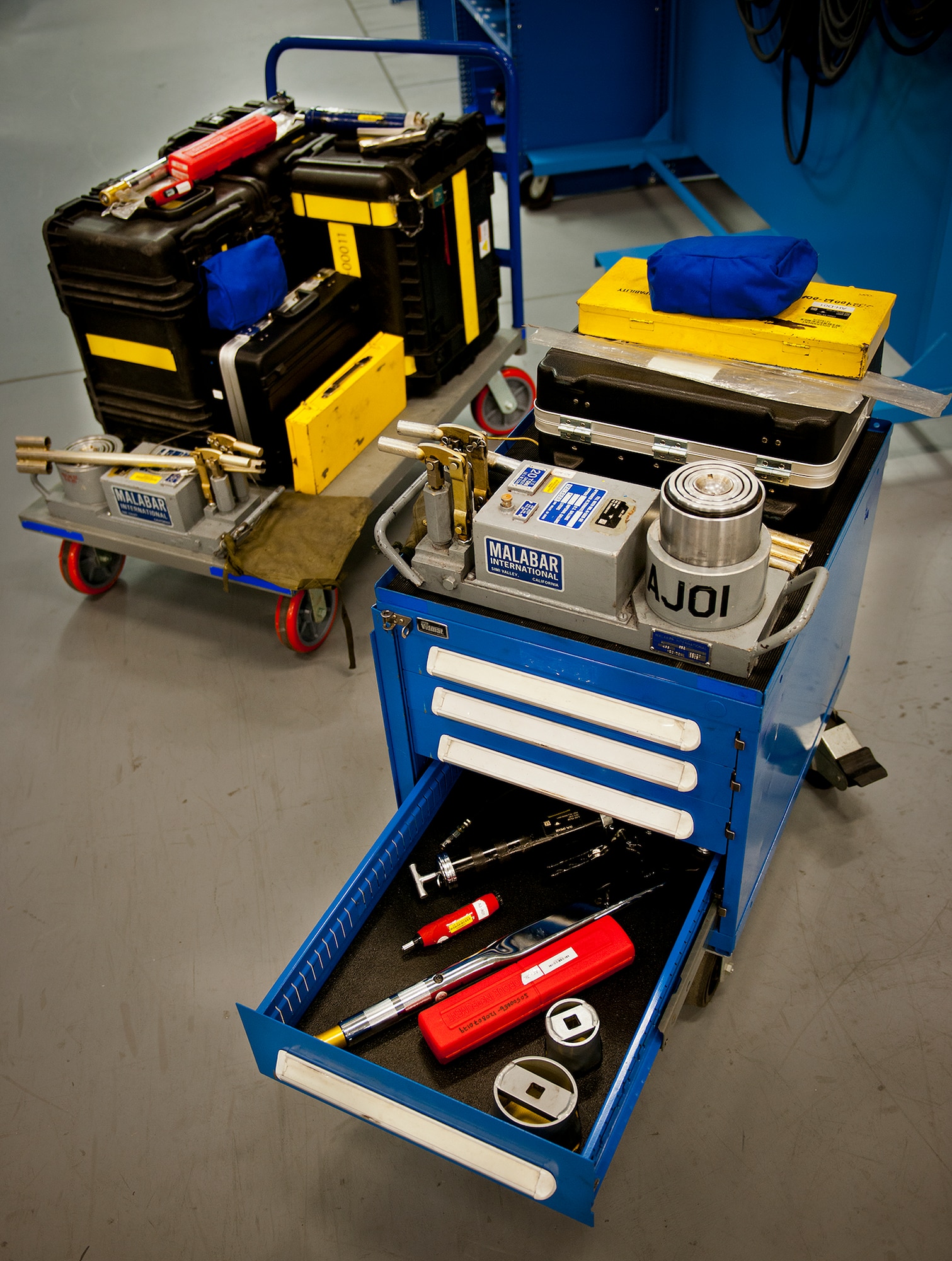 A cart full of more than 280 tools and equipment was previously required to complete brake and tire maintenance on a 33rd Fighter Wing F-35A.  The new blue box created by the Airmen of the 58th Aircraft Maintenance Unit's Support Section reduces the amount of tools required by 81 percent.  (U.S. Air Force photo/Samuel King Jr.)