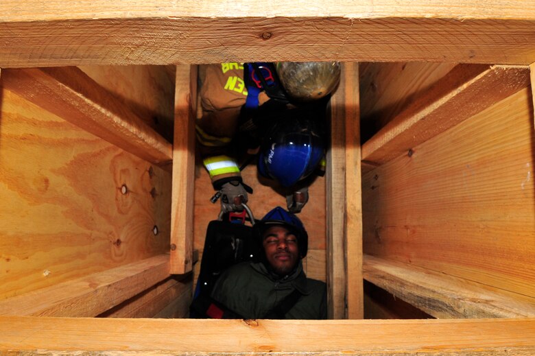 435th Civil Engineer Squadron fire fighters rescue a mock victim during a training exercise, March 21, 2013, Ramstein Air Base, Germany. The 435th Construction Training Squadron conducted rescue technician certification training that tested 11 fire fighters in simulated rescue operations (U.S. Air Force photo/Senior Airman Aaron-Forrest Wainwright)