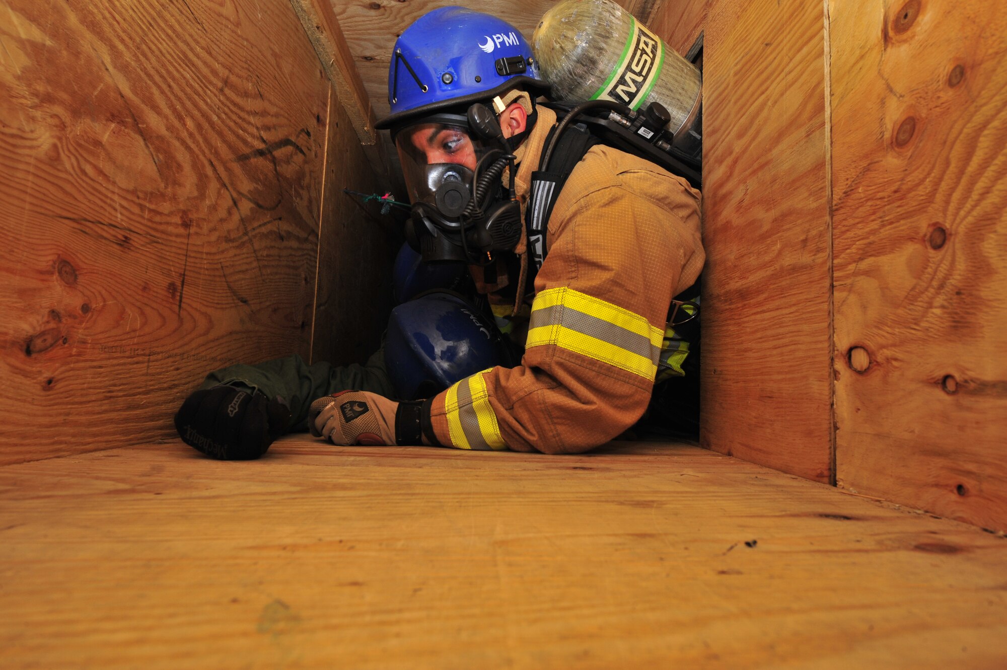 435th Civil Engineer Squadron fire fighters set up a tripod on top of the training facility in order to pull any potential victims out of harms way, March 21, 2013, Ramstein Air Base, Germany. The 435th Construction Training Squadron conducted rescue technician certification training that tested 11 fire fighters in simulated rescue operations. (U.S. Air Force photo/Senior Airman Aaron-Forrest Wainwright)