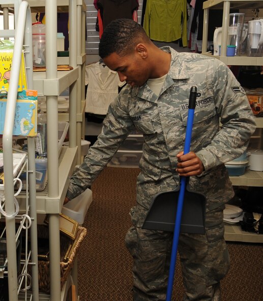 Airman 1st Class Barnett Jordan, 2nd Aircraft Maintenance Squadron weapons, looks through items at the Airman's Attic on Barksdale Air Force Base, La., April 2, 2013. The Airman's Attic takes donations and offers merchandise and uniform items free of charge to Airmen in the grades of E-1 through E-4. All other ranks can go to the attic the last week of every month. (U.S. Air Force photo/Senior Airman Sean Martin)
