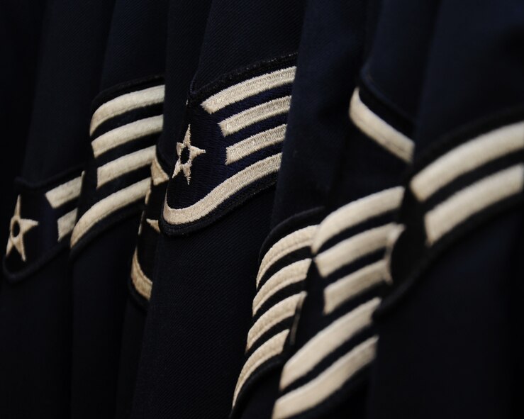 Service Dress coats are one of the many clothing items available to Airmen at the Airman's Attic. The Airman's Attic is a non-profit organization that receives donations of various items including clothes, household essentials, movies and uniforms. (U.S. Air Force photo/Senior Airman Sean Martin)