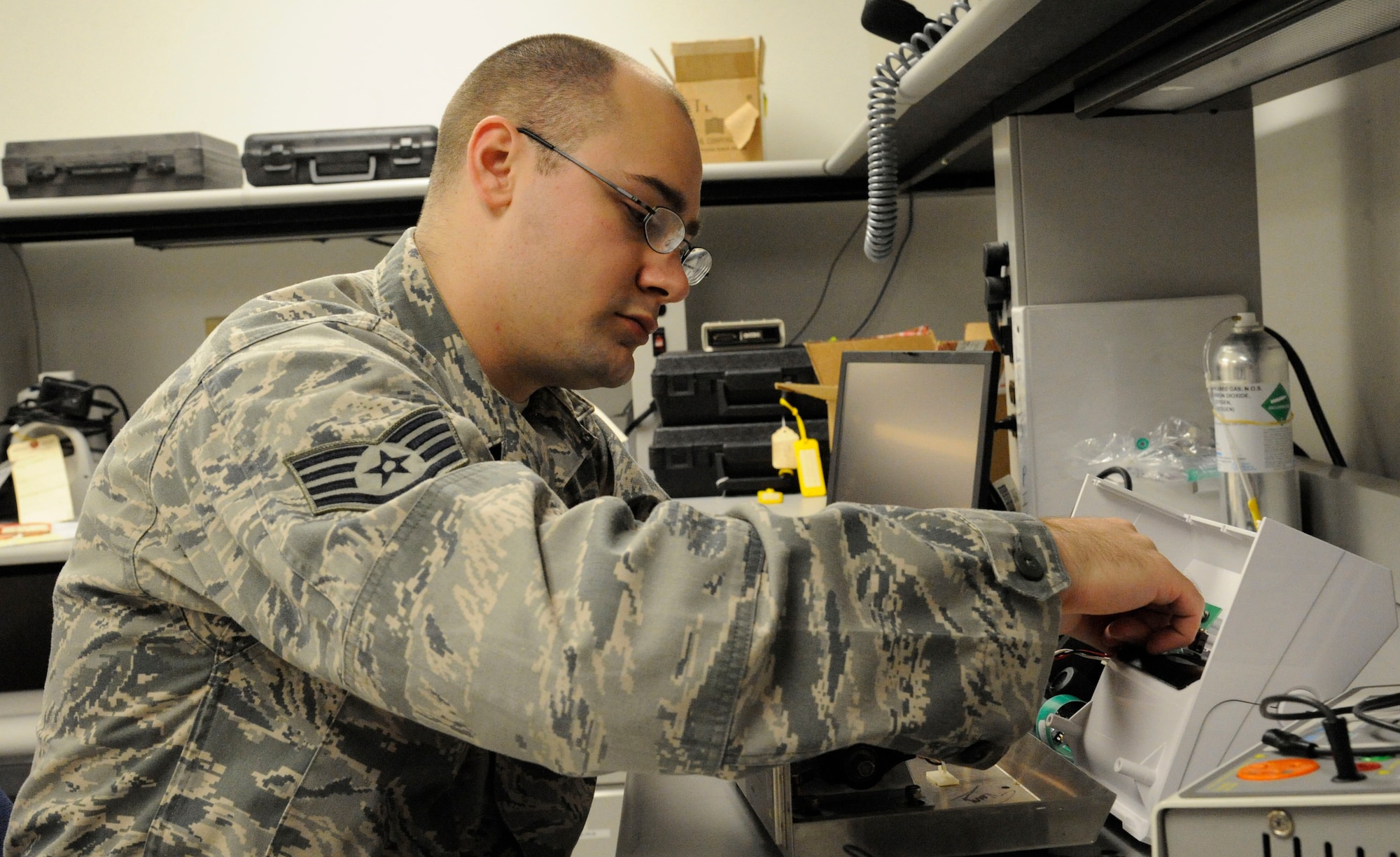 Staff Sgt. Andrew Bouck, 2nd Medical Group Biomedical Equipment Technician NCO in-charge of medical maintenance, unscrews a circuit breaker from an amalgamator on Barksdale Air Force Base, La., April 2, 2013. BMETs are responsible for the maintenance, upkeep and serviceability of all equipment the 2 MDG uses ranging from blood pressure cuffs to advanced X-ray machines. (U.S. Air Force photo/Airman 1st Class Andrew Moua)