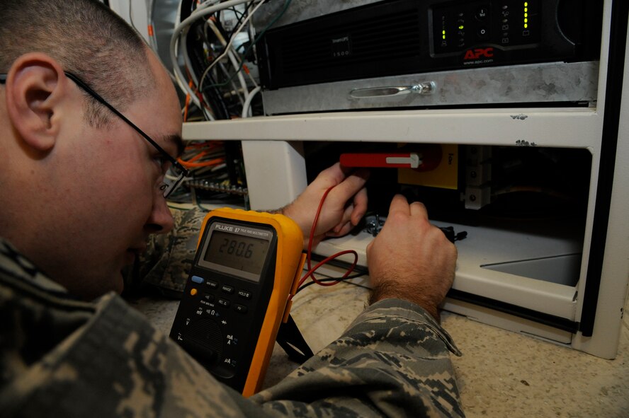 Staff Sgt. Andrew Bouck, 2nd Medical Group Biomedical Equipment Technician NCO in-charge of medical maintenance, checks a high voltage transformer on Barksdale Air Force Base, La., April 2, 2013. BMETs are responsible for the maintenance, upkeep and serviceability of all equipment the 2 MDG uses ranging from blood pressure cuffs to advanced X-ray machines. (U.S. Air Force photo/Airman 1st Class Andrew Moua)