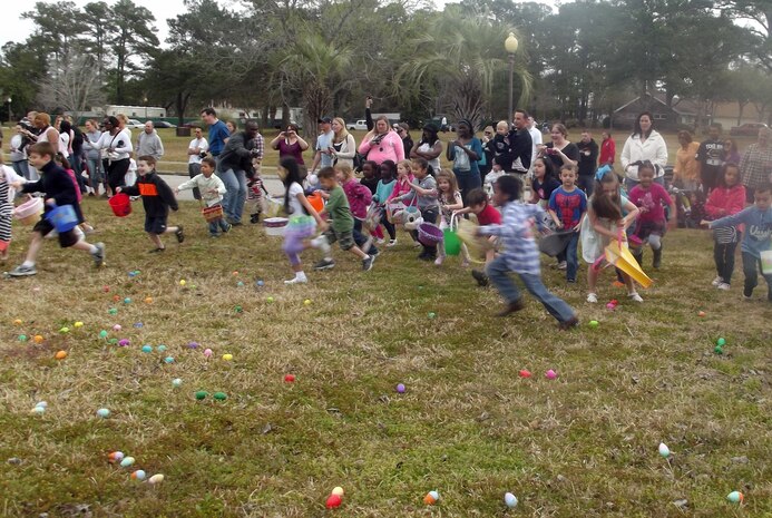 Children collect eggs during the Easter Egg Hunt at the annual Easter Event March 30, 2013, at Joint Base Charleston – Air Base, S.C. More than 200 JB Charleston youth hunted for eggs at the event put on by Air Base Youth Programs.  Participants enjoyed hunting for eggs, visiting with the Easter Bunny, and face painting. (Courtesy Photo) 