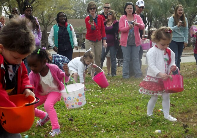Children search for eggs during the Easter Egg Hunt at the annual Easter Event March 30, 2013, at Joint Base Charleston – Air Base, S.C. More than 200 JB Charleston youth hunted for eggs at this event put on by Air Base Youth Programs.  Participants enjoyed hunting for eggs, visiting with the Easter Bunny, and face painting. (Courtesy Photo) 