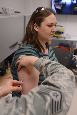 SPANGDAHLEM AIR BASE, Germany – U.S. Air Force SSgt. Sarah Ellis, 52nd Medical Operations Squadron NCO in charge of Allergy and Immunizations from Mount Hood Ore., gives a vaccine to Carrie Driver, from Townsend, Mont., Apr. 2, 2013. Vaccines are used as a preventative measure for anything from allergies to shingles. (U.S. Air Force photo by Airmen 1st Class Kyle Gese/Released)