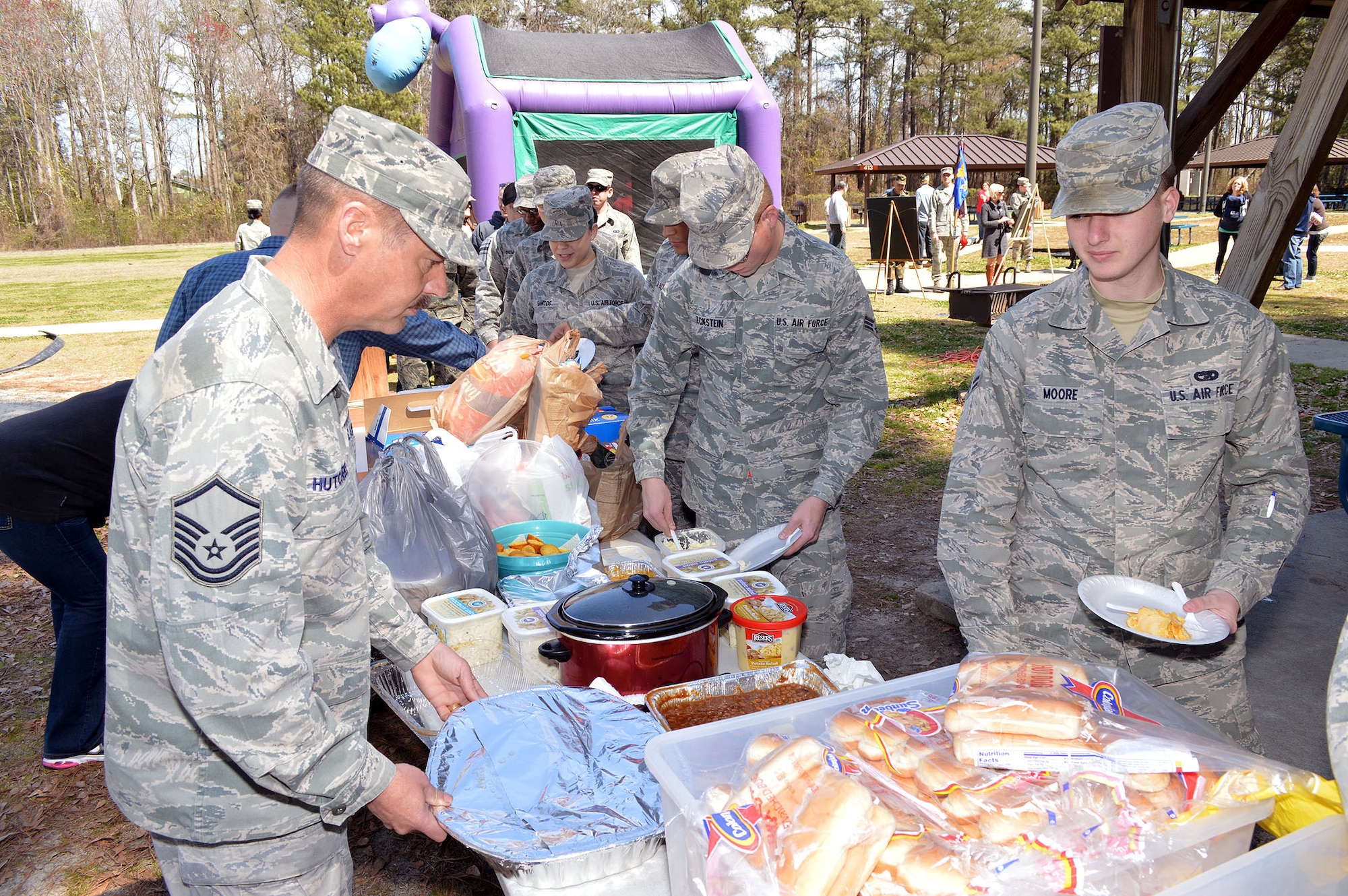 3rd Aerial Port Squadron Airmen and family members go through the food line during a picnic March 29 celebrating the squadron's 60th Anniversary at Pope Army Airfield, Fort Bragg, N.C.
