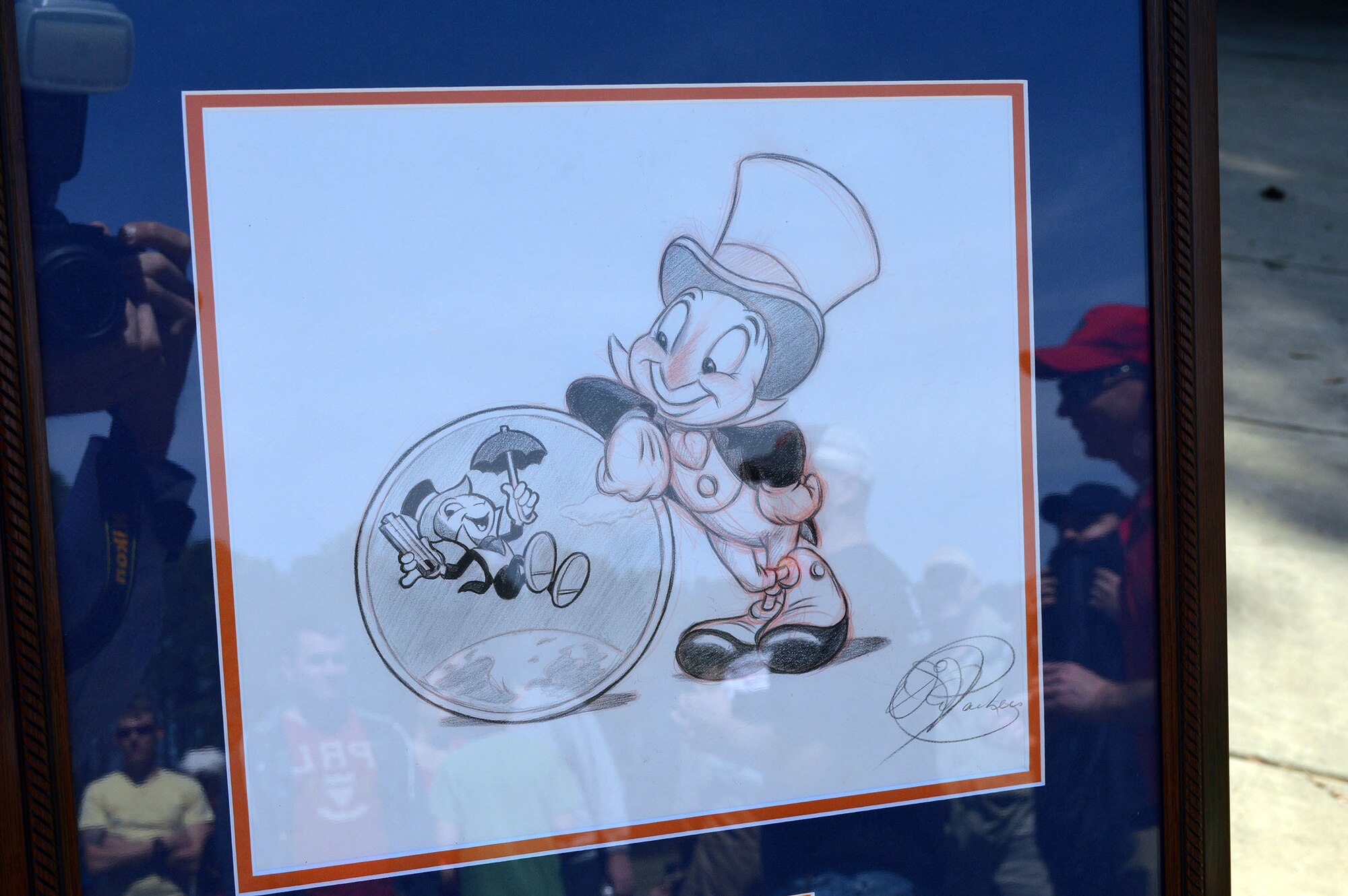 The Walt Disney Corporation provided a caricature drawing of the 3rd Aerial Port Squadron's mascot, Jiminy Cricket, to celebrate the squadron's 60th Anniversary.  Maj. Joseph Whittington, 3rd APS commander, unveiled the drawing to squadron personnel and family members during a picnic March 29, celebrating the squadron's anniversary that officially took place March 16 at Pope Army Airfield, Fort Bragg, N.C.
