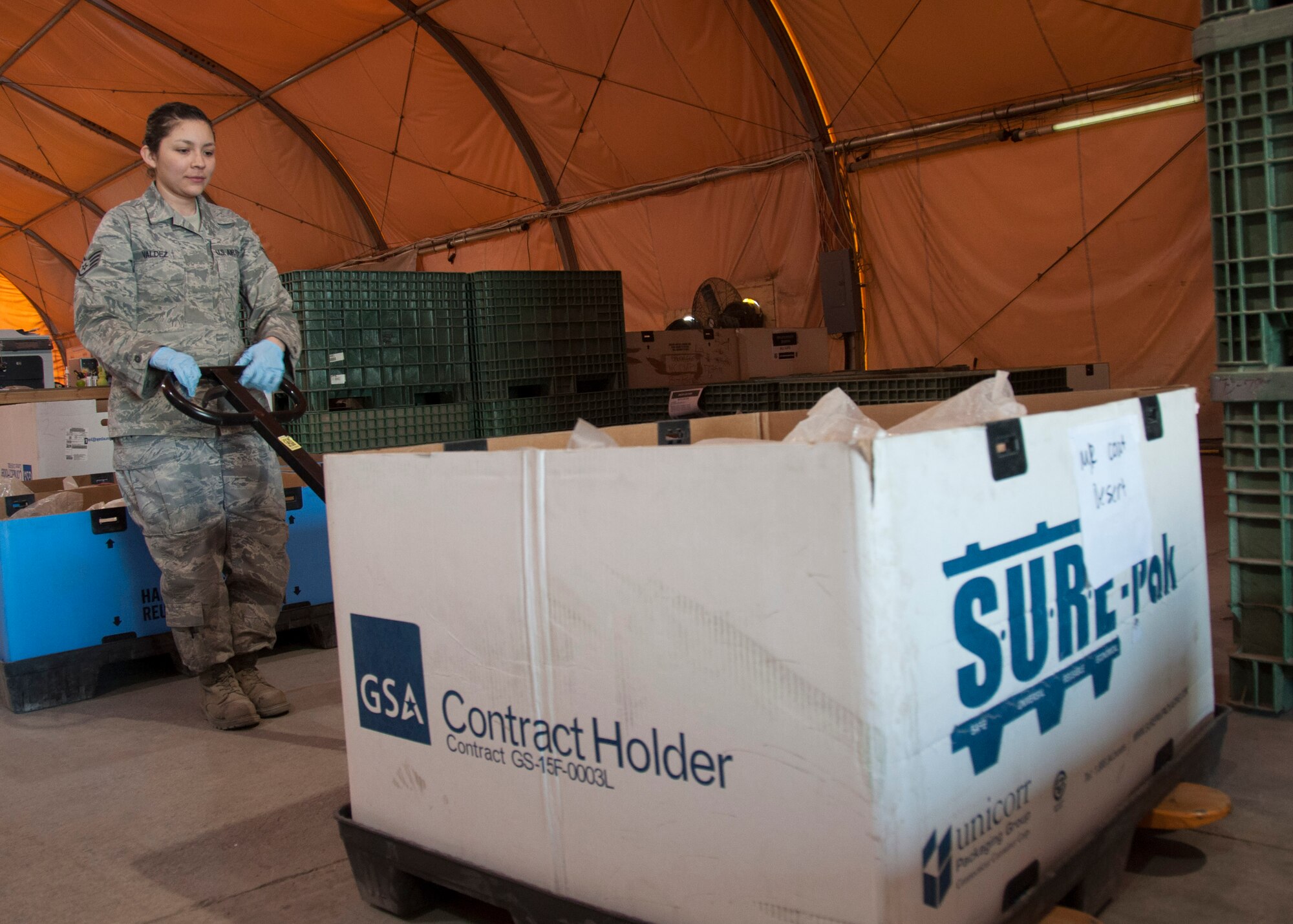 Staff Sgt. Laura Valdez, 376th Expeditionary Logistics Readiness Squadron shelf-life monitor, moves a pallet of returned equipment in the Expeditionary Theater Distribution Center March 29, 2013, at Transit Center at Manas, Kyrgyzstan. Valdez verifies the shelf-life dates on equipment as it is returned in order to determine if it is serviceable for reissue or needs to be discarded. She is deployed from Ramstein Air Base, Germany, and is a native of Chicago, Ill. (U.S. Air Force photo/Tech. Sgt. Rachel Martinez) 