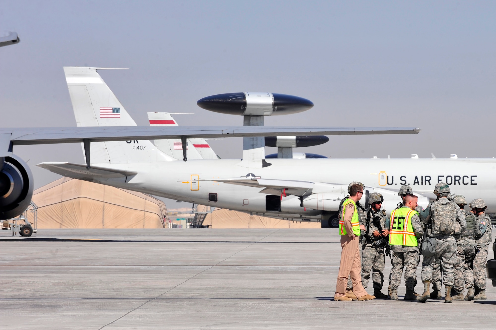 Wing exercise evaluator team members conduct a hotwash with members of the 380th Expeditionary Security Forces Squadron following a base defense exercise at an undisclosed location in Southwest Asia Mar. 29, 2013. The exercise objective was to test the security forces reaction-time in the event that intruders threatened Air Force assets. (U.S. Air Force photo by Tech. Sgt. Christina M. Styer/Released)  