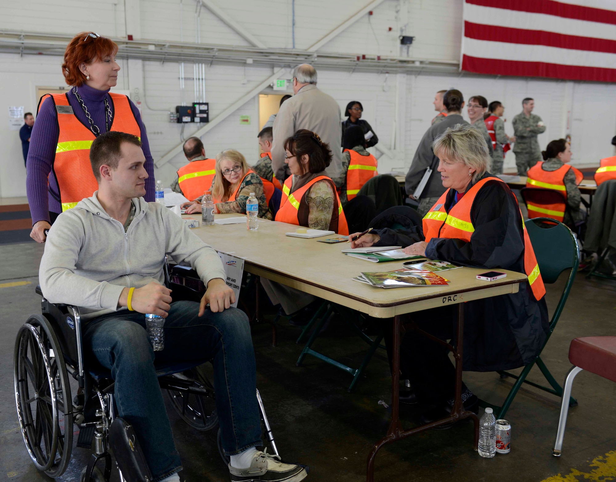 Airman Jake Giovati acts as a handicapped evacuee during a Noncombative Evacuation Operation Exercise at Hangar 5 on Joint Base Elmendorf-Richardson during Polar Force 13-3 April 1. The exercise is designed to test military readiness in the event of a natural disaster or military conflict. (U.S. Air Force photo by Tammie Ramsouer)
