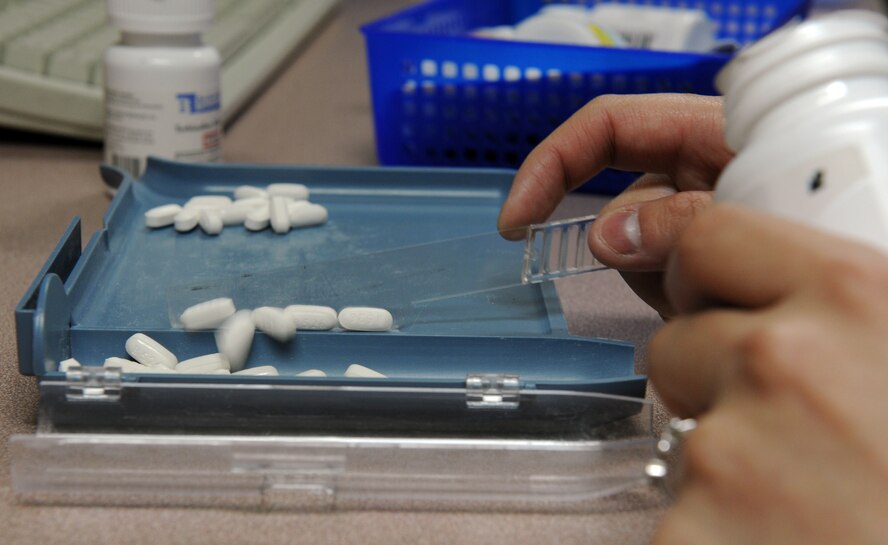 U.S. Air Force Airman 1st Class Dominique Abrams, 35th Medical Support Squadron pharmacy technician, counts prescription pills at Misawa Air Base, Japan, April 2, 2013. When a patient’s medication is not available for order from other manufacturers, pharmacists use an authorized compound recipe binder to make the medication specific to the patients’ needs. (U.S. Air Force photo by Airman 1st Class Kia Atkins)