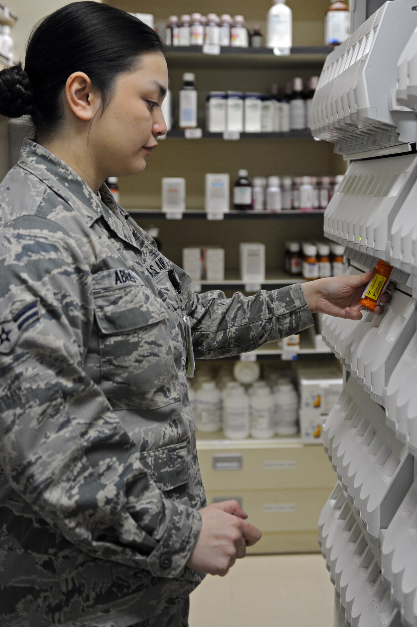 U.S. Air Force Airman 1st Class Dominique Abrams, 35th Medical Support Squadron pharmacy technician, fills a prescription at Misawa Air Base, Japan, April 2, 2013. The medication dispenser contains prescription drugs that are commonly prescribed, allowing fast and accurate distribution of medication. (U.S. Air Force photo by Airman 1st Class Kia Atkins)