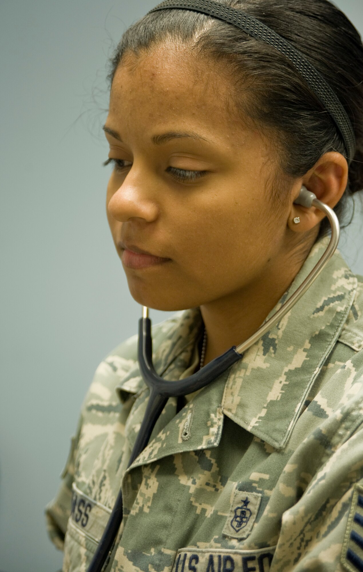 Staff Sgt. Leilani Bass, 39th Medical Operations Squadron aerospace medical service technician, checks a patient’s blood pressure April 2, 2013, at Incirlik Air Base, Turkey. Bass is credited with helping prevent her best friend from committing suicide during a video-conference. (U.S. Air Force photo by Senior Airman Anthony Sanchelli/Released)