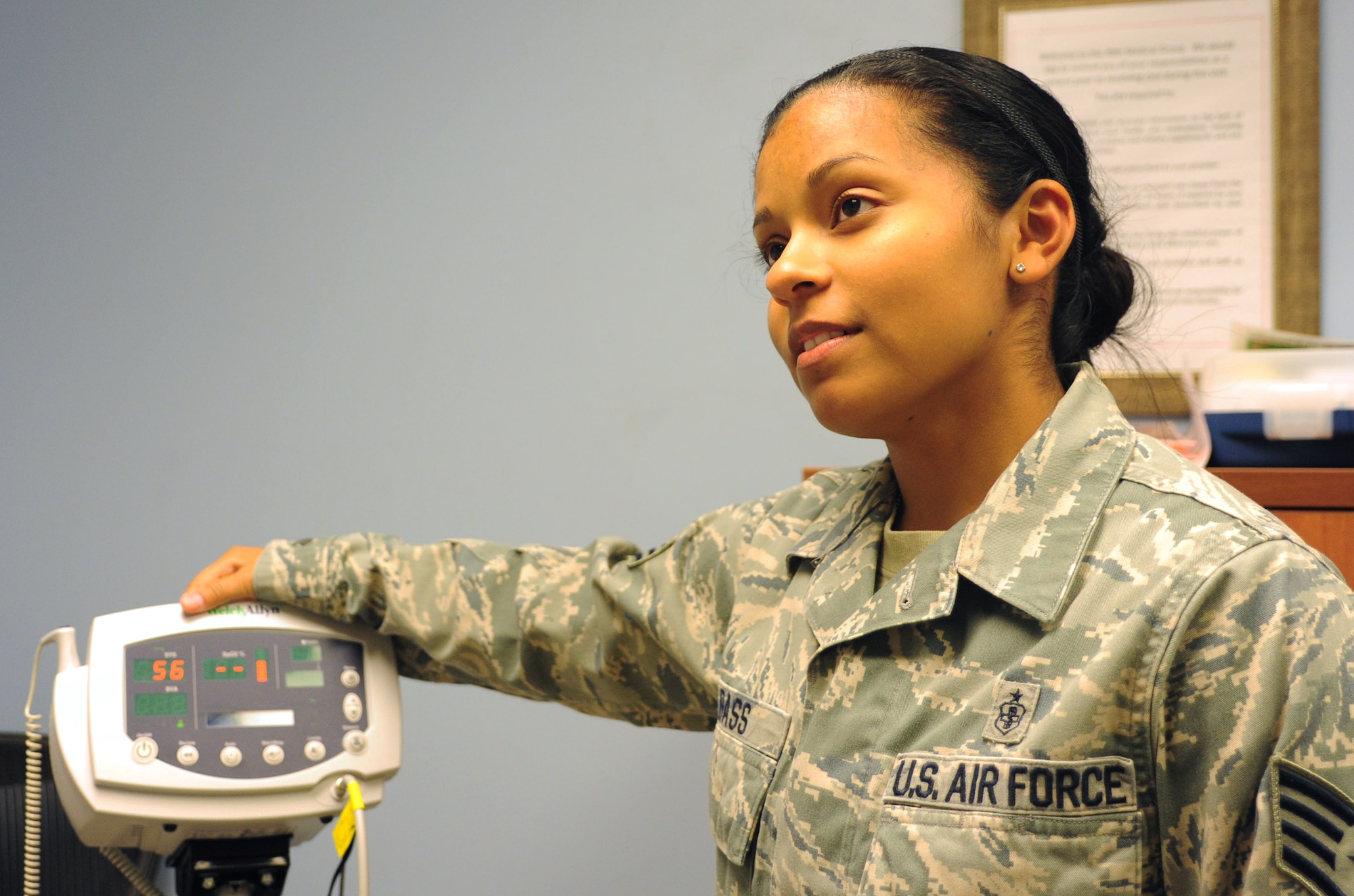 Staff Sgt. Leilani Bass, 39th Medical Operations Squadron aerospace medical service technician, waits as a blood pressure machine calculates for a patient April 2, 2013, at Incirlik Air Base, Turkey. Bass saved the life of her best friend during a video-conference when her friend contemplated committing suicide. (U.S. Air Force photo by Senior Airman Anthony Sanchelli/Released)