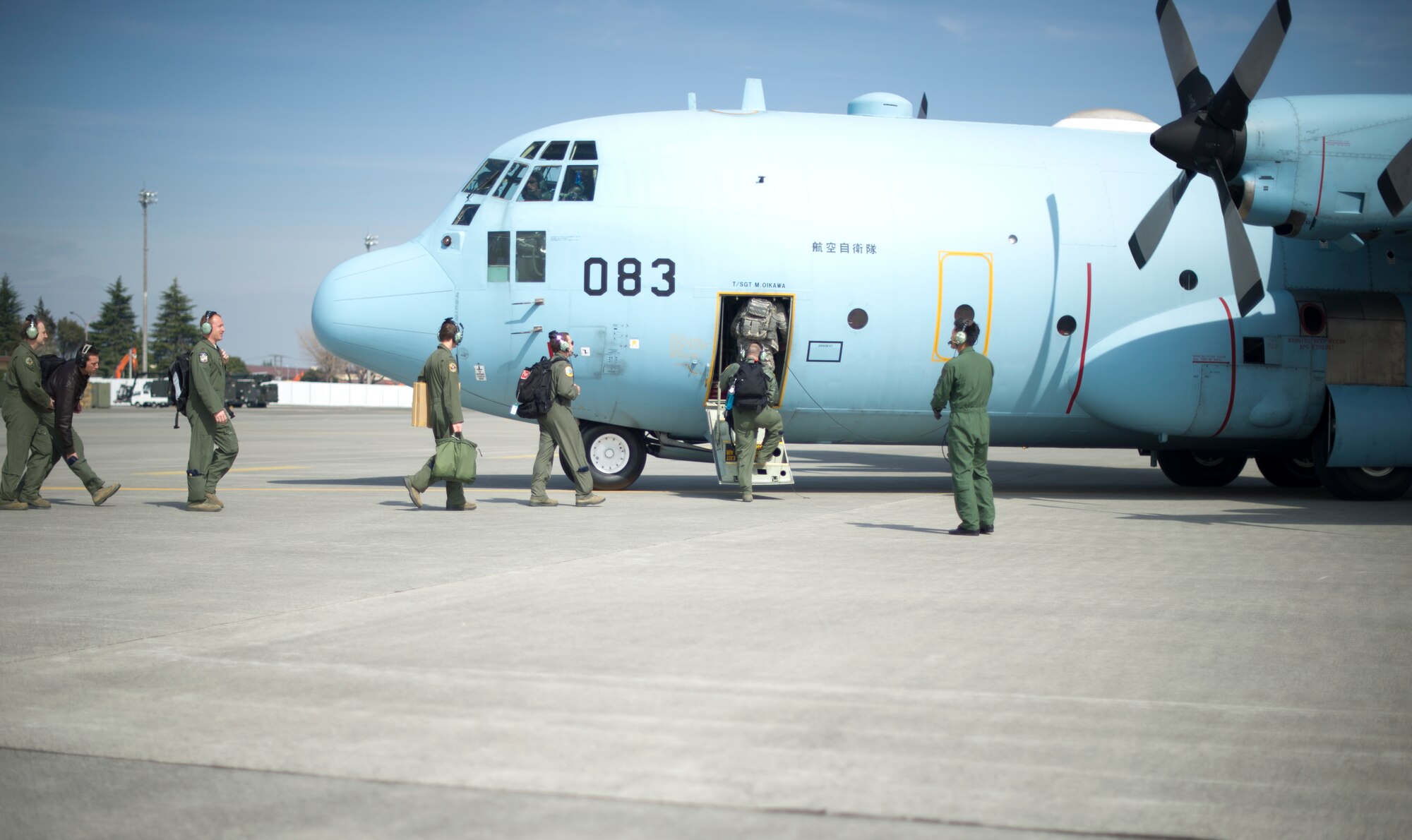 YOKOTA AIR BASE, Japan -- Members from the 36th Airlift Squadron board a visiting Japanese Air Self-Defense Force C-130 from the 401st Squadron, Komaki Air Base, Japan March 28, 2013, at Yokota Air Base, Japan. The JASDF C-130 transported 36 AS members to Komaki, where they met with base leadership and toured their squadron, airfield tower and a KC-767. (U.S. Air Force photo by Staff Sgt. Stacy Moless)        
