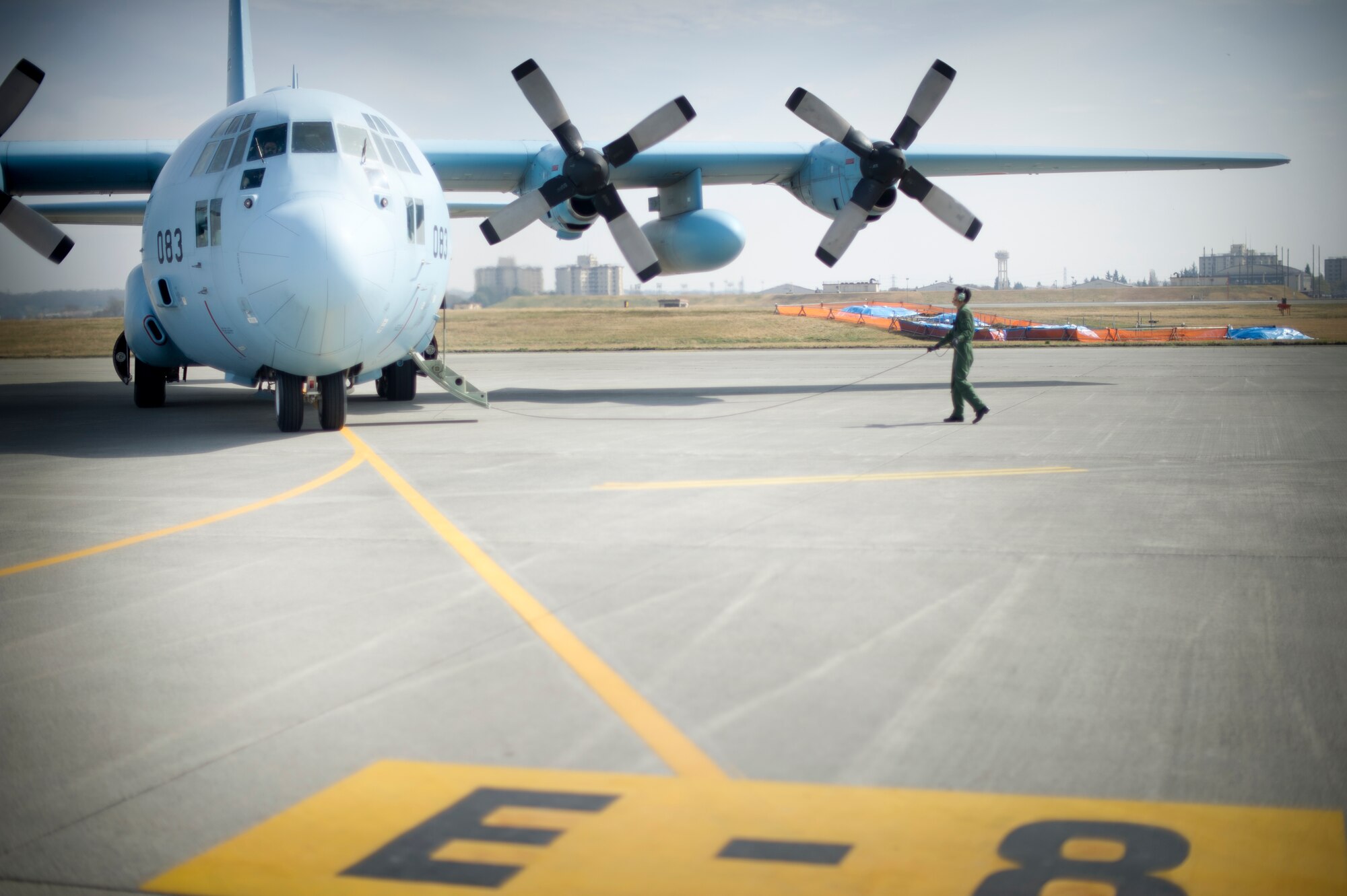 YOKOTA AIR BASE, Japan -- An crew member from the 401st Squadron, Komaki Air Base gets off a C-130 March 28, 2013, at Yokota Air Base, Japan. The Japan Air Self-Defense Force C-130 transported members from the 36th Airlift Squadron to Komaki Air Base, Japan where they met with the base leadership and toured their squadron, airfield tower and a KC-767. (U.S. Air Force photo by Staff Sgt. Stacy Moless)     
