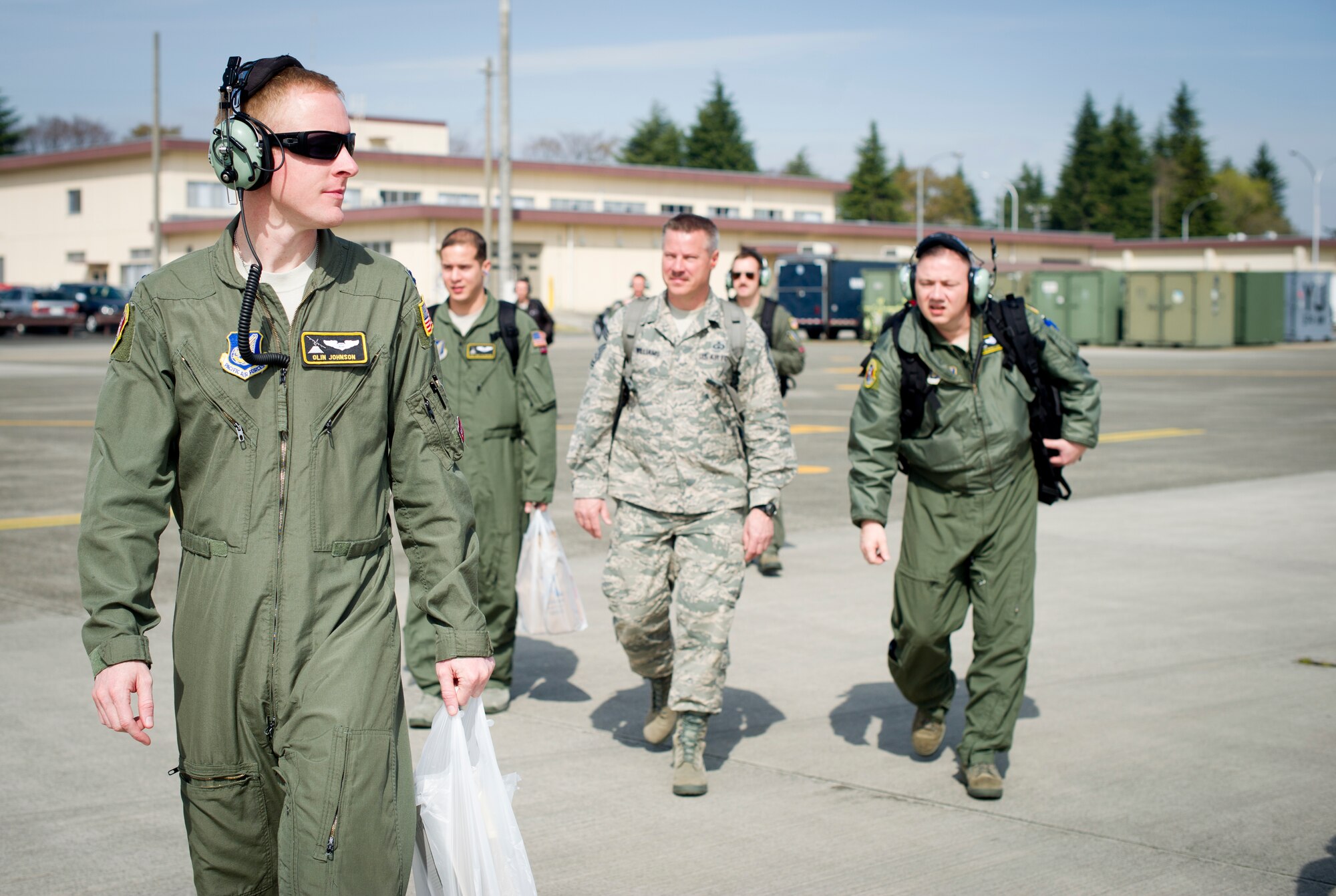 YOKOTA AIR BASE, Japan -- Members from the 36th Airlift Squadron walk to a visiting Japanese Air Self-Defense Force C-130 from the 401st Squadron, Komaki Air Base, Japan March 28, 2013, at Yokota Air Base, Japan. The JASDF C-130 transported 36 AS members to Komaki, where they met with base leadership and toured their squadron, airfield tower and a KC-767. (U.S. Air Force photo by Staff Sgt. Stacy Moless)     