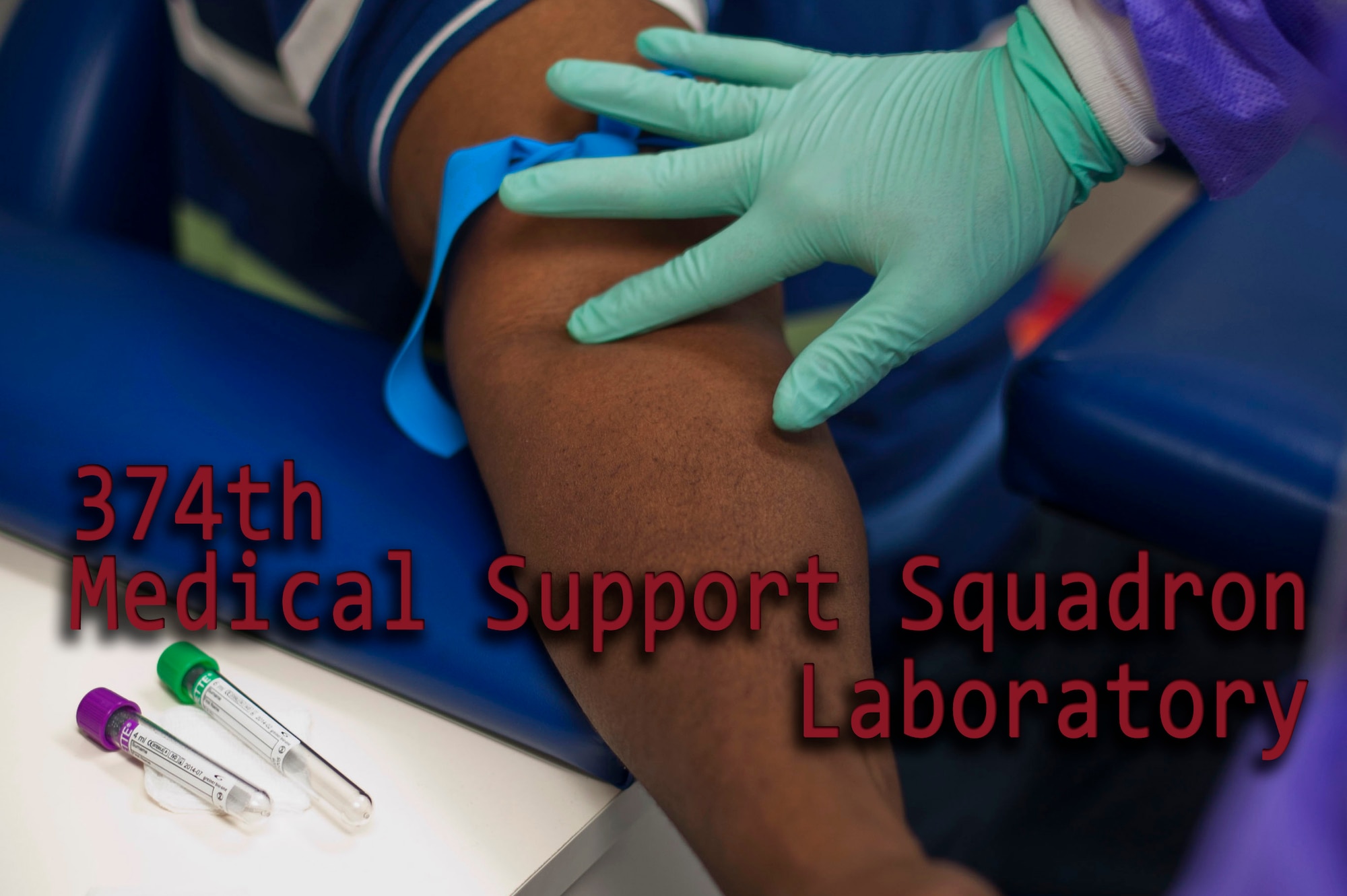 YOKOTA AIR BASE, Japan – A 374th Medical Support Squadron medical laboratory technician finds a patient’s vein before drawing blood at Yokota Air Base, Japan, April 1, 2013. Nearly 15,500 patients are seen annually at the laboratory.   (U.S. Air Force graphic by Airman 1st Class Meagan Schutter)