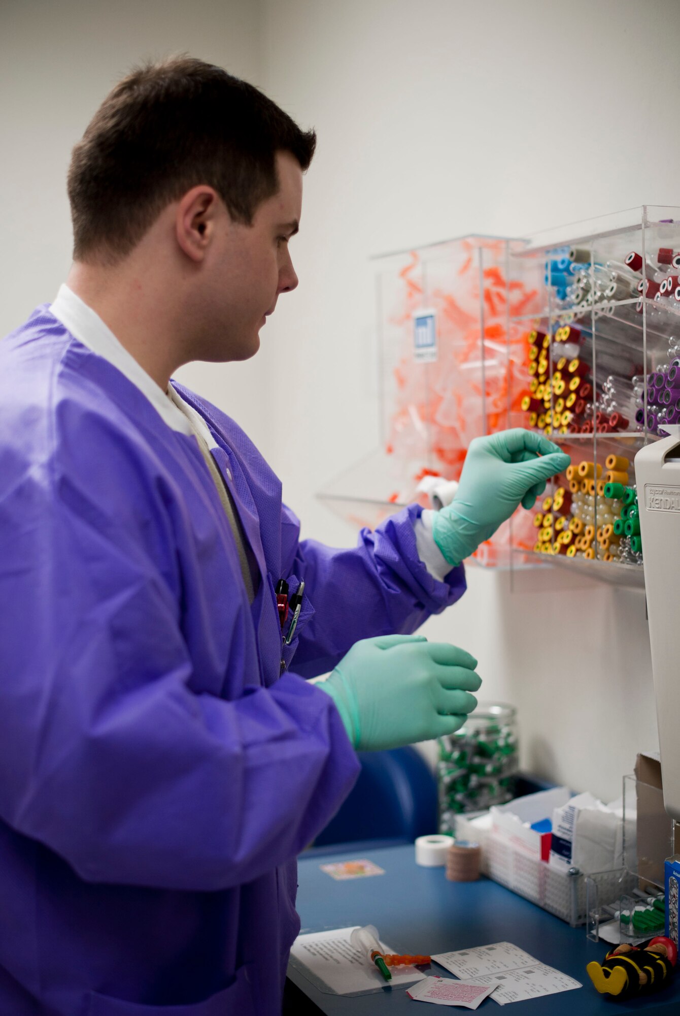 YOKOTA AIR BASE, Japan – Senior Airman Scott Strong, 374th Medical Support Squadron medical laboratory technician, selects vials before drawing blood from a patient at Yokota Air Base, Japan, April 1, 2013.  Nearly 15,500 patients are seen annually at the laboratory. (U.S. Air Force photo by Airman 1st Class Meagan Schutter)