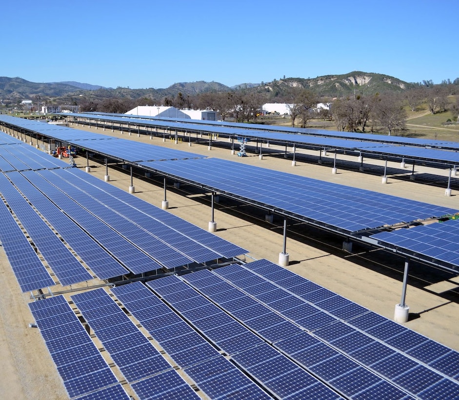 Solar panel arrays form a canopy at a construction site in Fort Hunter Liggett, Calif., March 12, 2013. The construction site is for phase 1 and 2 of a solar microgrid project at the installation, managed by the U.S. Army Corps of Engineers Sacramento District. Phase 1 was completed in April 2012, and generates one megawatt of power, which is enough energy to power 250 to 300 homes. Phase 2, scheduled for completion in May 2013, will generate an additional one megawatt of power and is expected to be the second of four at the post. The Sacramento District awarded contracts of $8.4 million for phase I and $9.7 million for phase 2. Along with the energy production, the cover provided by the panel arrays will shade the majority of the post's vehicles. Fort Hunter Liggett is one of six pilot installations selected by the U.S. Army to be net zero energy, meaning the installation will create as much energy as it uses.