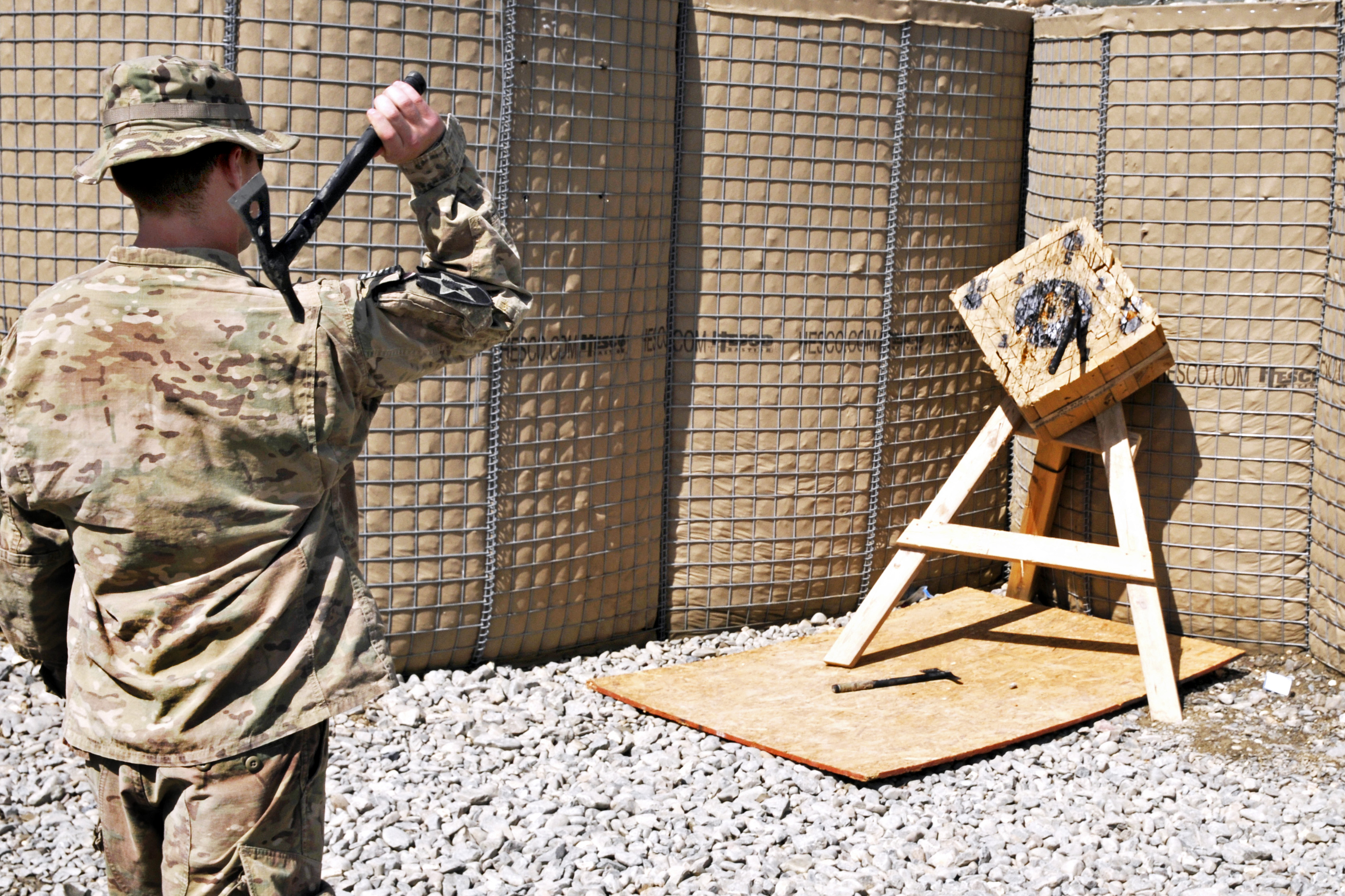U.S. Army Spc. Kirk Calabrese throws a Tomahawk to demonstrate the