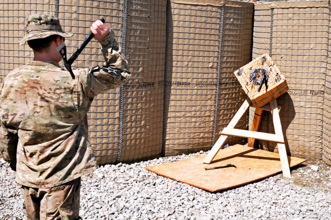 U.S. Army Spc. Kirk Calabrese throws a Tomahawk to demonstrate the final physical event of the Top Tomahawk competition on Forward Operating Base Spin Boldak in Kandahar province, Afghanistan, March 29, 2013. Calabrese is assigned to the 2nd Infantry Division's 2nd Battalion, 23rd Infantry Regiment, 4th Striker Brigade Combat Team.