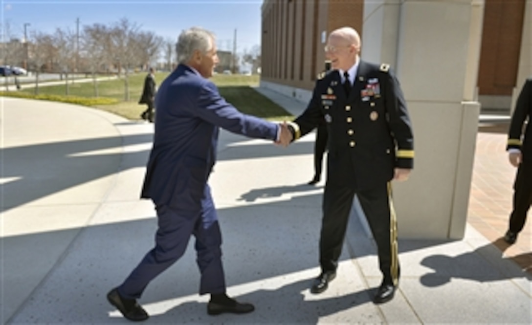 National Defense University President Maj. Gen. Gregg F. Martin, U.S. Army, welcomes Secretary of Defense Chuck Hagel as he arrives at Fort McNair in Washington, D.C., on April 3, 2013.  Hagel will address an audience of roughly 600 faculty, students and guests on the strategic and fiscal challenges facing the Department of Defense.  