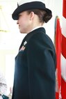 Ensign Iris D. Manso, a naval officer with the Regimental Aid Station for Combat Logistics Regiment 27, 2nd Marine Logistics Group, prepares for her first salute as a Navy officer at Paradise Point Officer’s Club aboard Camp Lejeune, N.C., March 28, 2013. The first salute is a long-standing tradition where a newly commissioned officer gives a silver dollar to the first servicemember who renders them a salute. (U.S. Marine Corps photo by Lance Cpl Shawn Valosin)