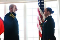 Lt. Cmdr. Michael A. Czigler (left) and Ensign Iris D. Manso, a naval officer with the Regimental Aid Station for Combat Logistics Regiment 27, 2nd Marine Logistics Group, recite the Officer’s Oath during Manso’s commissioning ceremony at Paradise Point Officer’s Club aboard Camp Lejeune, N.C., March 28, 2013. Manso earned her master’s degree, and was a petty officer first class prior to being commissioned. (U.S. Marine Corps photo by Lance Cpl. Shawn Valosin)