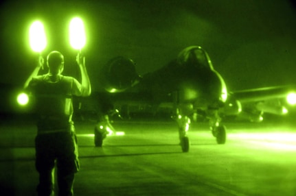 Senior Airman Daniel Young marshals in an A-10 Thunderbolt II for munitions disarming after an Oct. 28 mission at Al Asad Air Base, Iraq. The A-10C's are assigned to the 104th Expeditionary Fighter Squadron, which is made up primarily of members from the 175th Maryland Air National Guard. Airman Young is a Maryland Air National Guard crew chief. The 104th EFS is the first unit to use the C-model A-10 in a combat zone. Its upgrades have made air power more efficient and have streamlined the close-air-support mission.