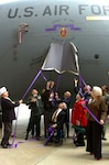 National Guard members including the Mississippi Adjutant General Maj. Gen. Harold Cross and Purple Heart Medal awardees including the Secretary of Veterans Affairs Mr. Gordon H. Mansfield unveil nose art on a Mississippi Air National Guard C-17 Globemaster III during an aircraft naming and dedication ceremony Nov. 20 at the 172nd Airlift Wing in Jackson, Miss. The wing routinely flies aeromedical evacuation missions from Balad Air Base Hospital, Iraq to Landstuhl Regional Medical Center, Germany, and then on to Walter Reed Medical Center, District of Columbia. They have transported more then 19,000 patients since its mobilization for the mission in October 2005.