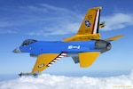 An F-16C Fighting Falcon from the Texas Air National Guard's 111th Fighter Squadron flies with a special paint job in honor of the squadron's 90th anniversary. All the colors and markings have specific meanings, reflecting the unit's nine-decade history. The rudder is painted like a JN-4 Jenny, which the squadron flew in the 1920s. The schemes for the wings and flaps recall the paint schemes of the pre-World War II era. The blue fuselage represents the Korean War, in which the squadron earned credit for two air victories. The gray underside represents the jet age. The "N5 A" was the insignia the squadron's P-51 Mustangs sported during World War II, in which the squadron claimed 44 air victories. Also representing World War II is the star on the fuselage, while the star on the wing represents the pre-World War II era. "Ace in the Hole" and the star on the tail replicate the markings of the squadron's F-84s during the Korean War. The ventral fin, partially obscured, reads "Est. 1917." Today the 111th FS is part of the 147th Fighter Wing, based on Ellington Field in Houston.