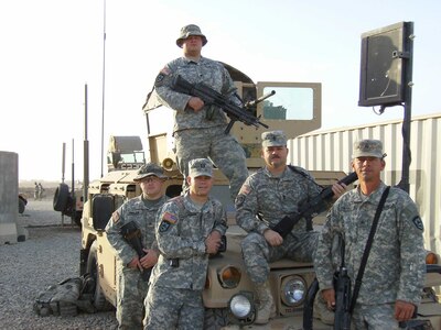 Five members of Cathy Hammack's family are serving in Iraq. Her husband, two sons, brother-in-law and son-in-law all are serving with the 111th Engineer Brigade. They are Sgt. Maj. Keith Hammack, husband (second from right); Capt. Keith Hammack, Jr. , son (second from left); Spc. Casey Hammack, son (top); Sgt. Roy Hammack, brother-in-law(right), and Sgt. Casey Phalen, son-in-law (left).