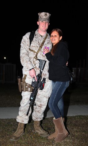 Staff Sgt. Eric J. Shelton Jr., a data network specialist with 8th Engineer Support Battalion, poses for a picture with his wife during a going-away ceremony aboard Camp Lejeune, N.C., March 28, 2013. Families and friends gathered to bid farewell to their loved ones as they began their journey to Afghanistan.