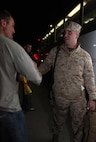 Marines with 2nd Explosive Ordnance Disposal Company, 8th Engineer Support Battalion shake hands with servicemembers as they board the bus during a going-away ceremony aboard Camp Lejeune, N.C., March 28, 2013. EOD technicians who were not deploying attended the ceremony to wish their brothers good luck on their deployment to Afghanistan.