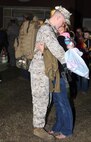 A Marine with 8th Engineer Support Battalion hugs his wife one more time before boarding the bus during a departure ceremony aboard Camp Lejeune, N.C., March 28, 2013. Families and friends gathered to bid farewell to their loved ones as they began their journey to Afghanistan.