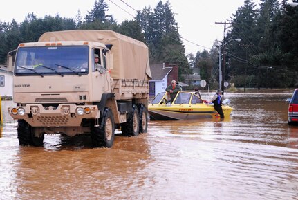 Nearly 500 Washington State Army and Air National Guardmembers were activated in early December and worked to restore power and ensure safe travel around flooded roads, among other duties. The Guard mobilized with about 75 vehicles that could get through many of the flooded areas that regular vehicles could not.