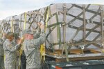 Nevada National Guard Soldiers unload two pallets of MREs (Meals Ready to Eat) for the more than 3,000 displaced residents of Fernley, Nev., Jan. 6. The town of Fernley (located about 30 miles east of Reno) was flooded with icy water when a levee holding back the Truckee canal gave way Jan. 5 after a severe winter storm. About 50 Guardmembers in the state have been activated to help with the storm damage.