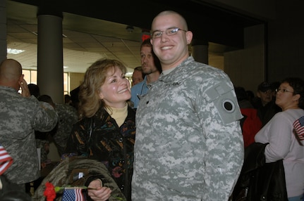 Proud family members like Melissa Gwynne, mother of SPC Jonathan Gwynne of Company G, 237th Brigade Support Battalion, as well as many Medina community members filled the Medina Performing Arts center for the deployment ceremony Jan. 4. Company G is deploying for a yearlong tour to Kuwait with the Ohio Army National Guard's 37th Infantry Brigade Combat Team.