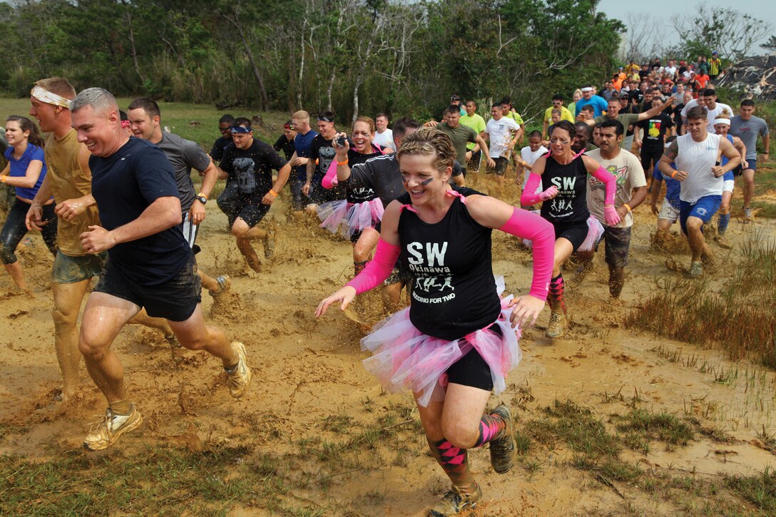 Participants run during the single Marine program’s Bushido Mud Run March 30 at Camp Hansen. The participants were required to run through 10 kilometers of Camp Hansen’s training ranges. The run was open to all status of forces agreement personnel ages 18 and older.