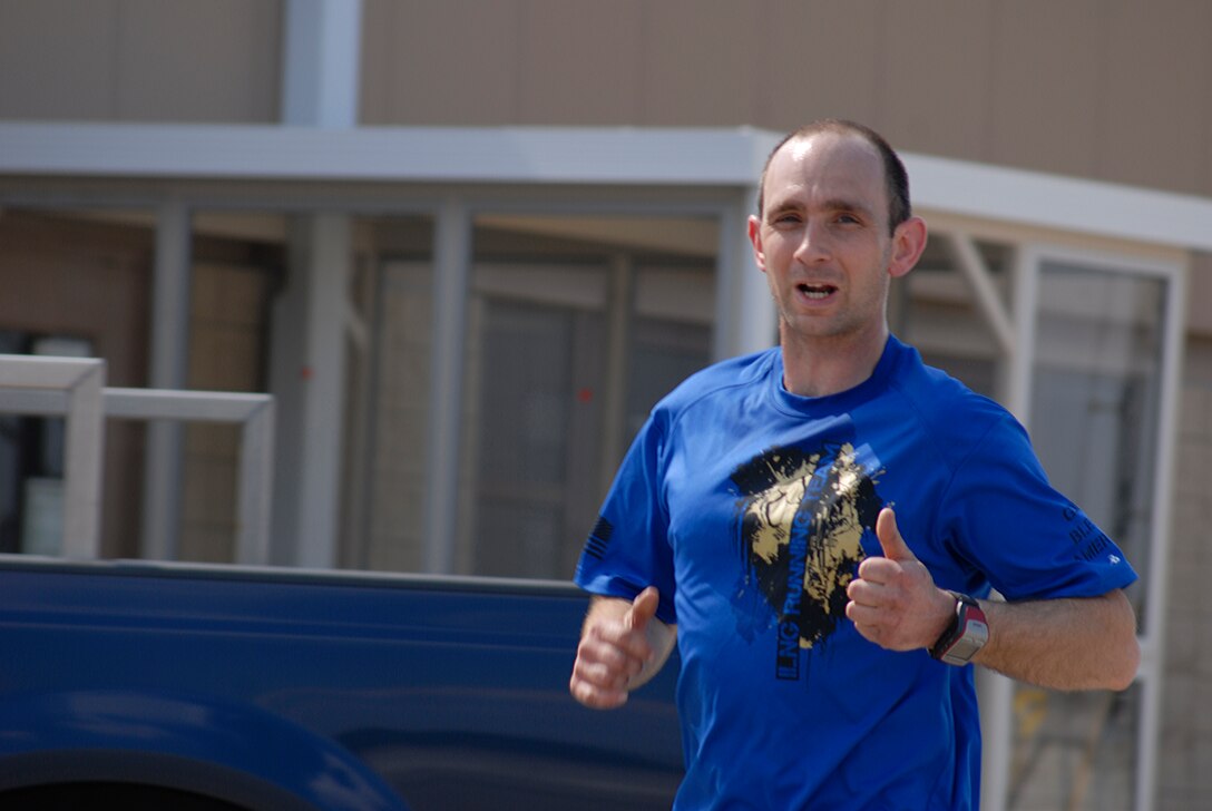 U.S. Air Force Tech. Sgt. Bradley Wheeler runs one of 18 miles during the second annual Tactical Air Control Party Association 24 Hour Run Challenge at the 182nd Airlift Wing in Peoria, Ill., March 29, 2013.  Sixty-two runners ran 161.75 miles around the installation over the course of 24 hours and raised over $8,200 in support of the TACP community and their families.  The 182nd team also ran in remembrance of Staff Sgt. Jacob Frazier, a member of the Peoria-based 169th Air Support Operations Squadron who was killed in action near Geresk, Afghanistan, exactly 10 years earlier.  (U.S. Air Force photo by Staff Sgt. Lealan Buehrer//Released)