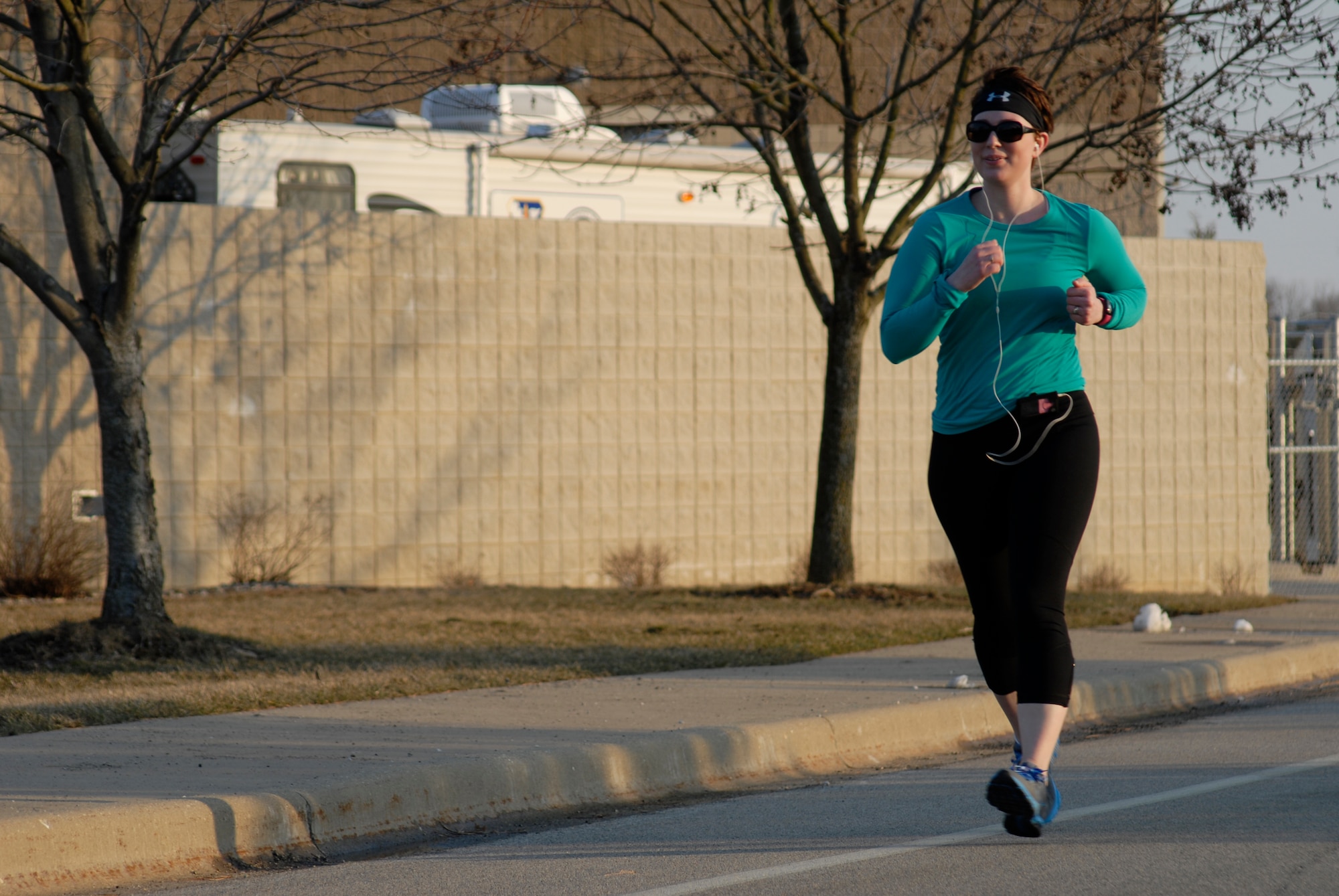 U.S. Army Sgt. Krysta Theobald runs one of five miles during the second annual Tactical Air Control Party Association 24 Hour Run Challenge at the 182nd Airlift Wing in Peoria, Ill., March 28, 2013.  Sixty-two runners ran 161.75 miles around the installation over the course of 24 hours and raised over $8,200 in support of the TACP community and their families.  The 182nd team also ran in remembrance of Staff Sgt. Jacob Frazier, a member of the Peoria-based 169th Air Support Operations Squadron who was killed in action near Geresk, Afghanistan, 10 years earlier on March 29, 2003.  (U.S. Air Force photo by Staff Sgt. Lealan Buehrer//Released)
