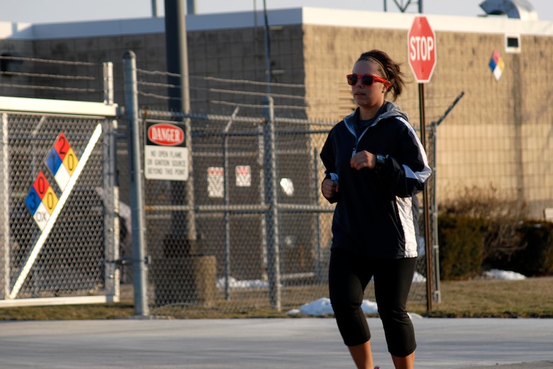 U.S. Air Force Senior Airman Jenna Calderone runs one of 12.5 miles at the second annual Tactical Air Control Party Association 24 Hour Run Challenge at the 182nd Airlift Wing in Peoria, Ill., March 28, 2013.  Sixty-two runners ran 161.75 miles around the installation over the course of 24 hours and raised over $8,200 in support of the TACP community and their families.  The 182nd team also ran in remembrance of Staff Sgt. Jacob Frazier, a member of the Peoria-based 169th Air Support Operations Squadron who was killed in action near Geresk, Afghanistan, 10 years earlier on March 29, 2003.  (U.S. Air Force photo by Staff Sgt. Lealan Buehrer//Released)