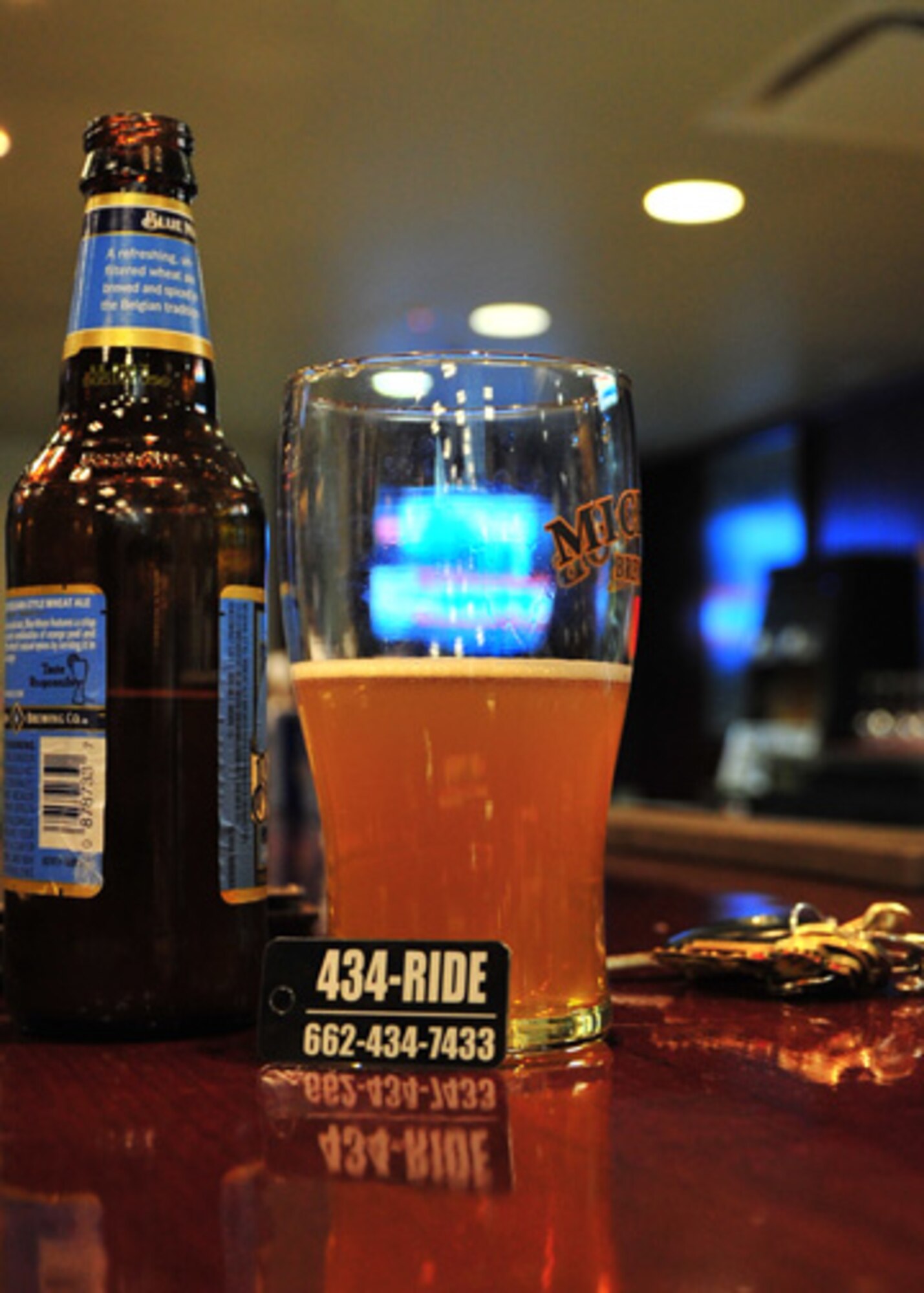 The simple yet bold key ring tag offered by the 434-RIDE program offers a reminder to Airmen: if you are out drinking, have a plan. One side of the tag has a place for Airmen to write in a wingman’s name and number that can come pick them up if in need, while the other side offers the number to 434-RIDE to call in case of all plans falling through.(U.S. Air Force Photo/Airman 1st Class Stephanie Englar)