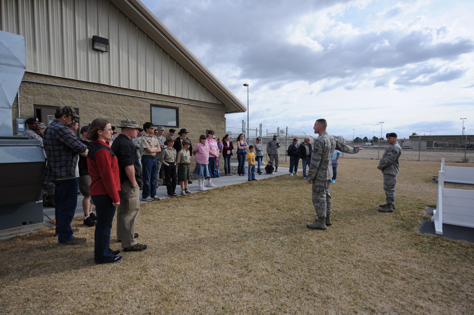 U.S. Air Force Tech. Sgt. Justin Devaney, 366th Security Forces Squadron kennel master, explains a K-9 obstacle training course at Mountain Home Air Force Base, Idaho, April 1, 2013. The course helps trainers teach dogs how to follow commands and navigate obstacles while on or off their leash. (U.S. Air Force photo/Airman 1st Class Malissa Lott)