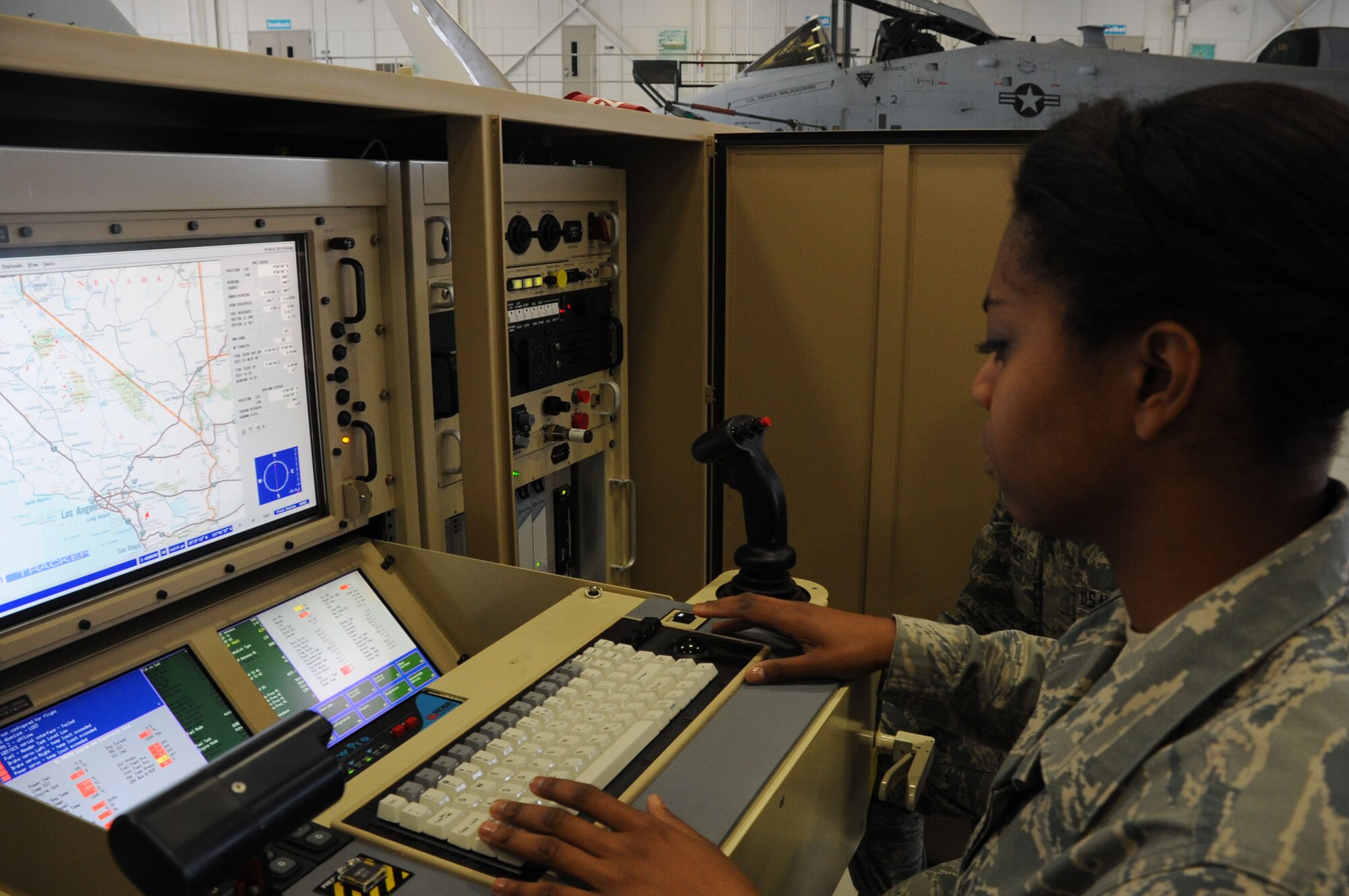 Airman Shayne Hughes, 363rd Training Squadron Airmen-in-Training in the new Remotely Piloted Aircraft armament course, conducts a systems check on the MQ-9A Reaper prior to a Hellfire missile upload exercise at Sheppard Air Force Base, Texas, April 4, 2013.  The RPA armament course will graduate its first students April 8.  (U.S. Air Force photo/Dan Hawkins) 