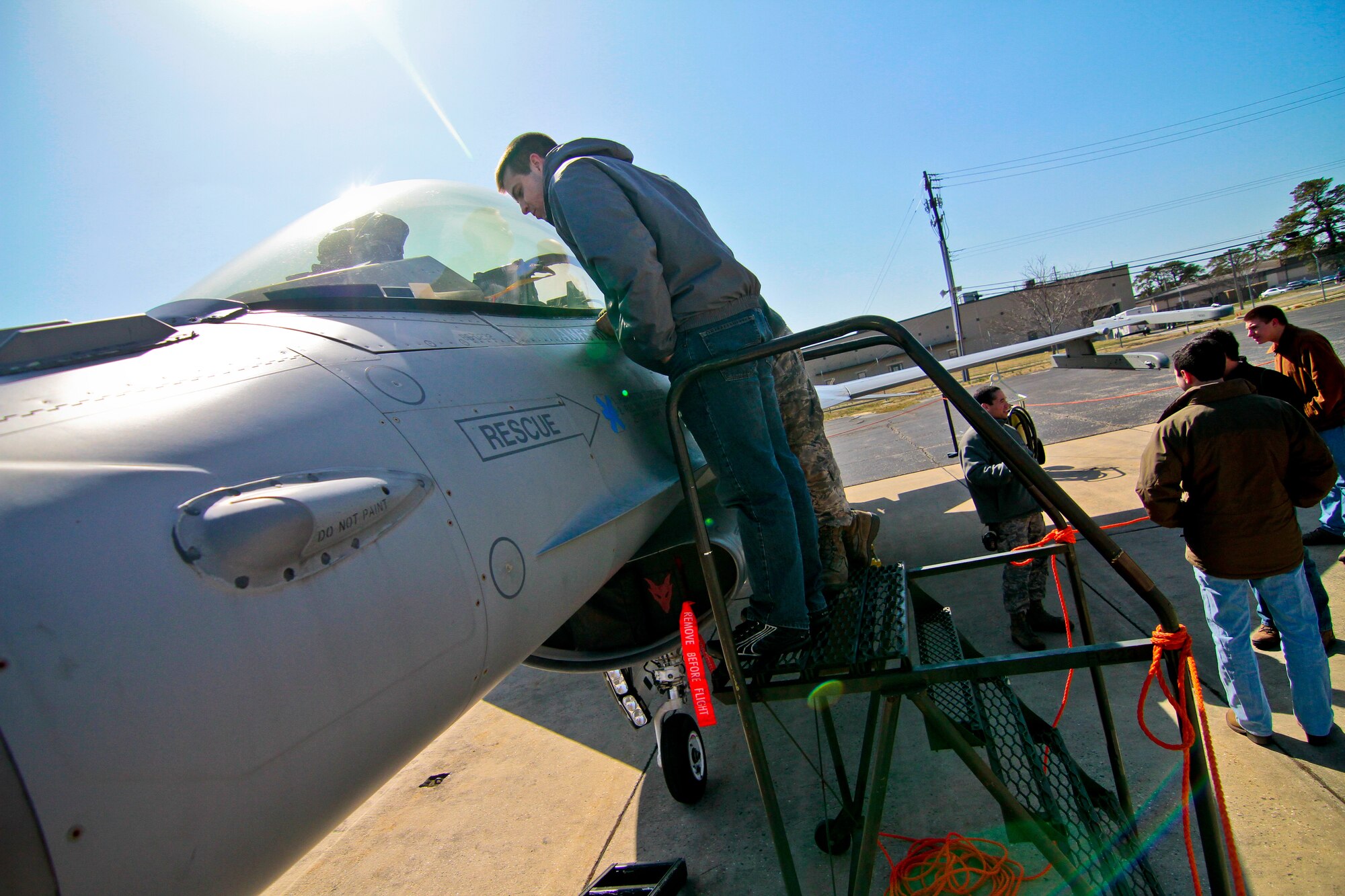 A picture of Aeronautical engineering students from Lehigh University getting a close up look at a 177th Fighter Wing F-16C Fighting Falcon.