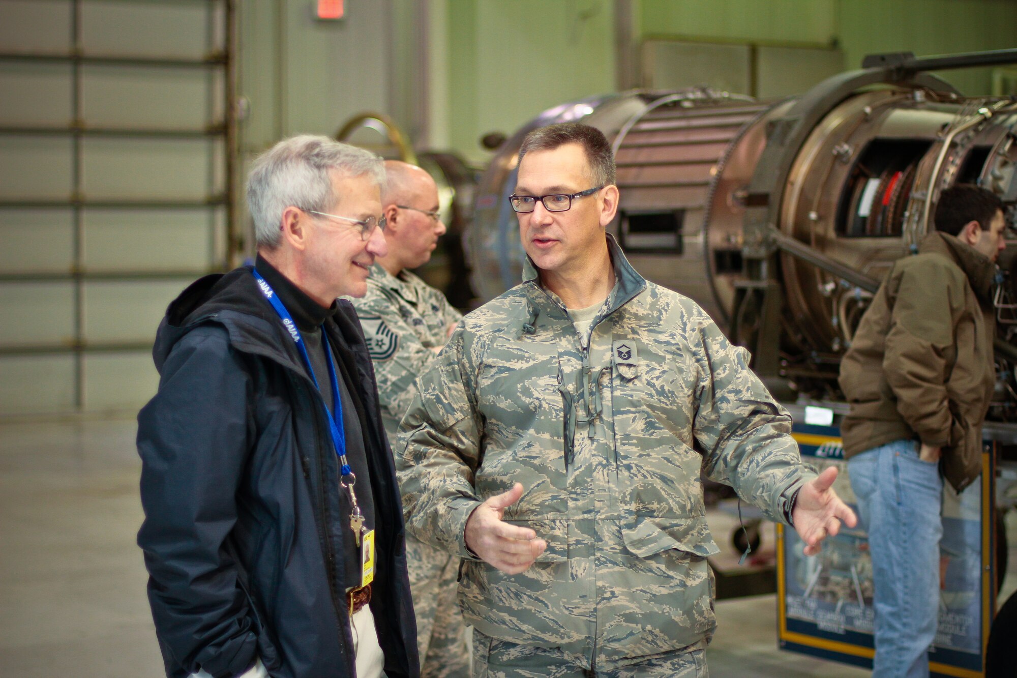 A picture of New Jersey Air National Guard Master Sgt. Andrew Moseley talking to aeronautical engineering professor Dr. Terry Hart.