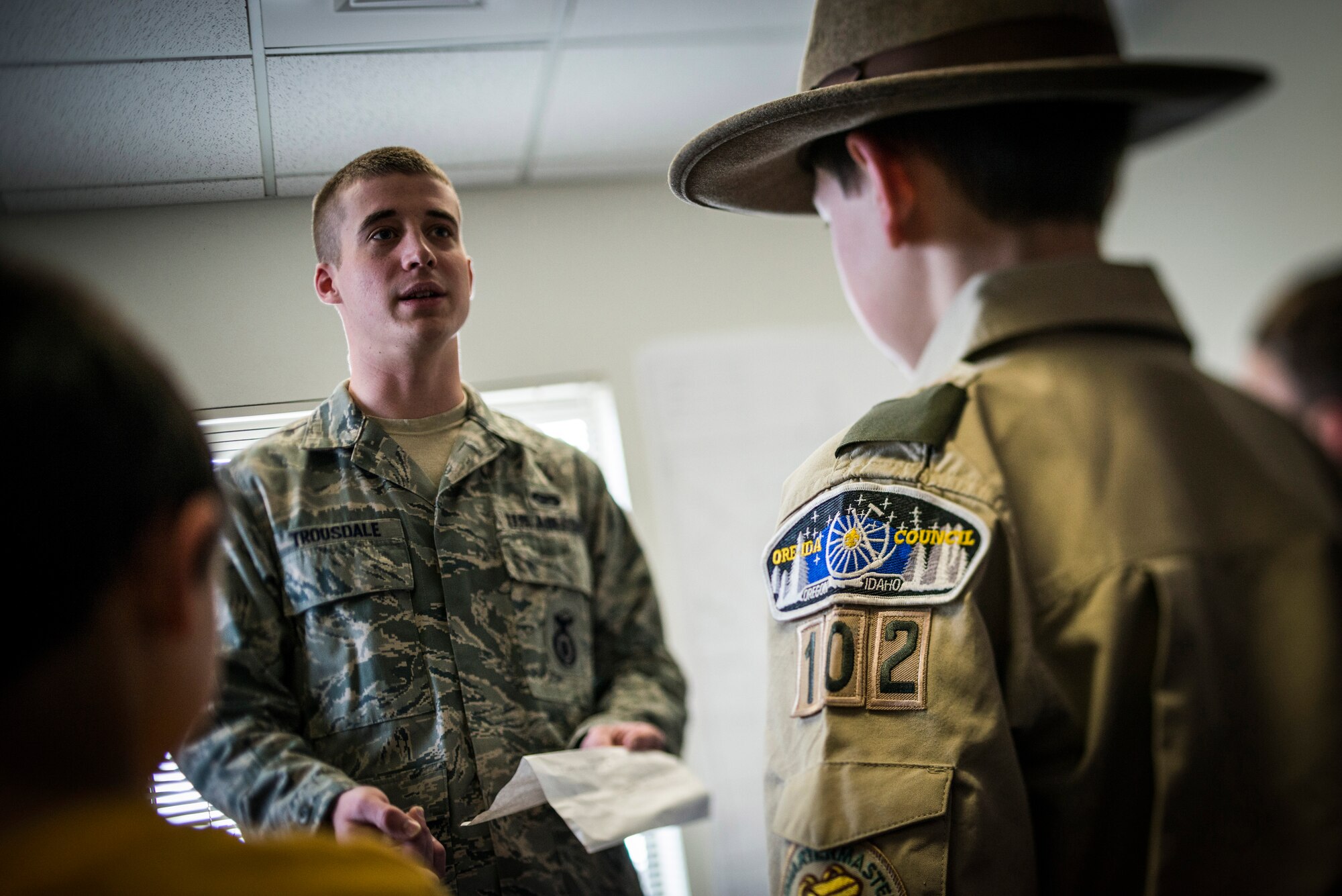 U.S. Air Force Airman 1st Class Tyler Trousdale, 366th Security Forces Squadron, talks to Boy Scout Troop 102 at the 366 SFS military working dog kennel at Mountain Home Air Force Base, Idaho, April 1, 2013. Trousdale explained the Air Force core values of integrity, service and excellence. (U.S. Air Force photo/Tech. Sgt. Samuel Morse)